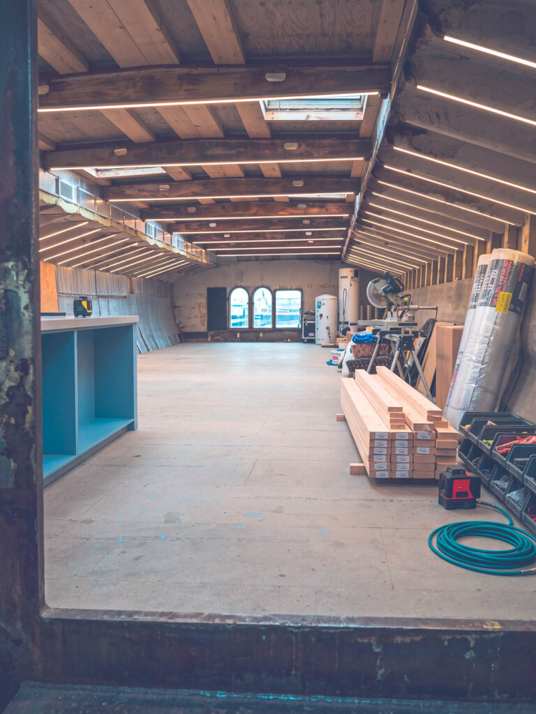 View through the barge interior showing framing and materials
