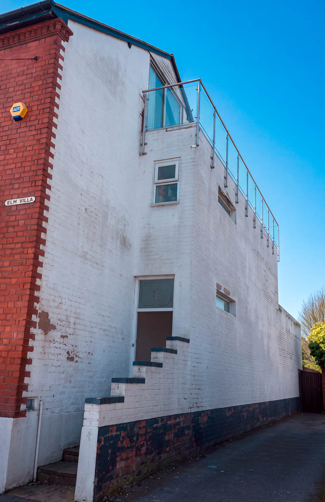 Harborne side elevation before refurbishment with worn white paint and exposed patches of brickwork