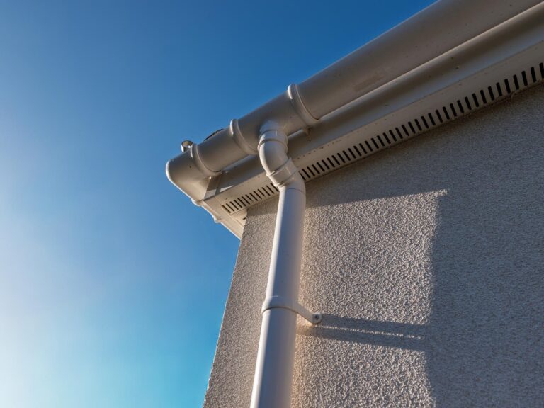 Hove spray cork exterior detail around gutter, soffit and downpipe