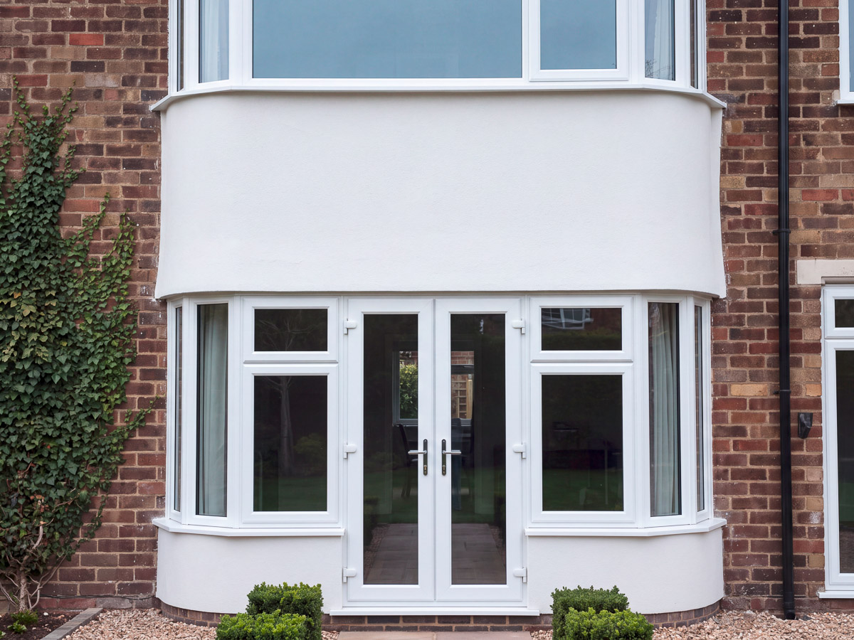 Completed bay window exterior with a light finish beside existing brickwork