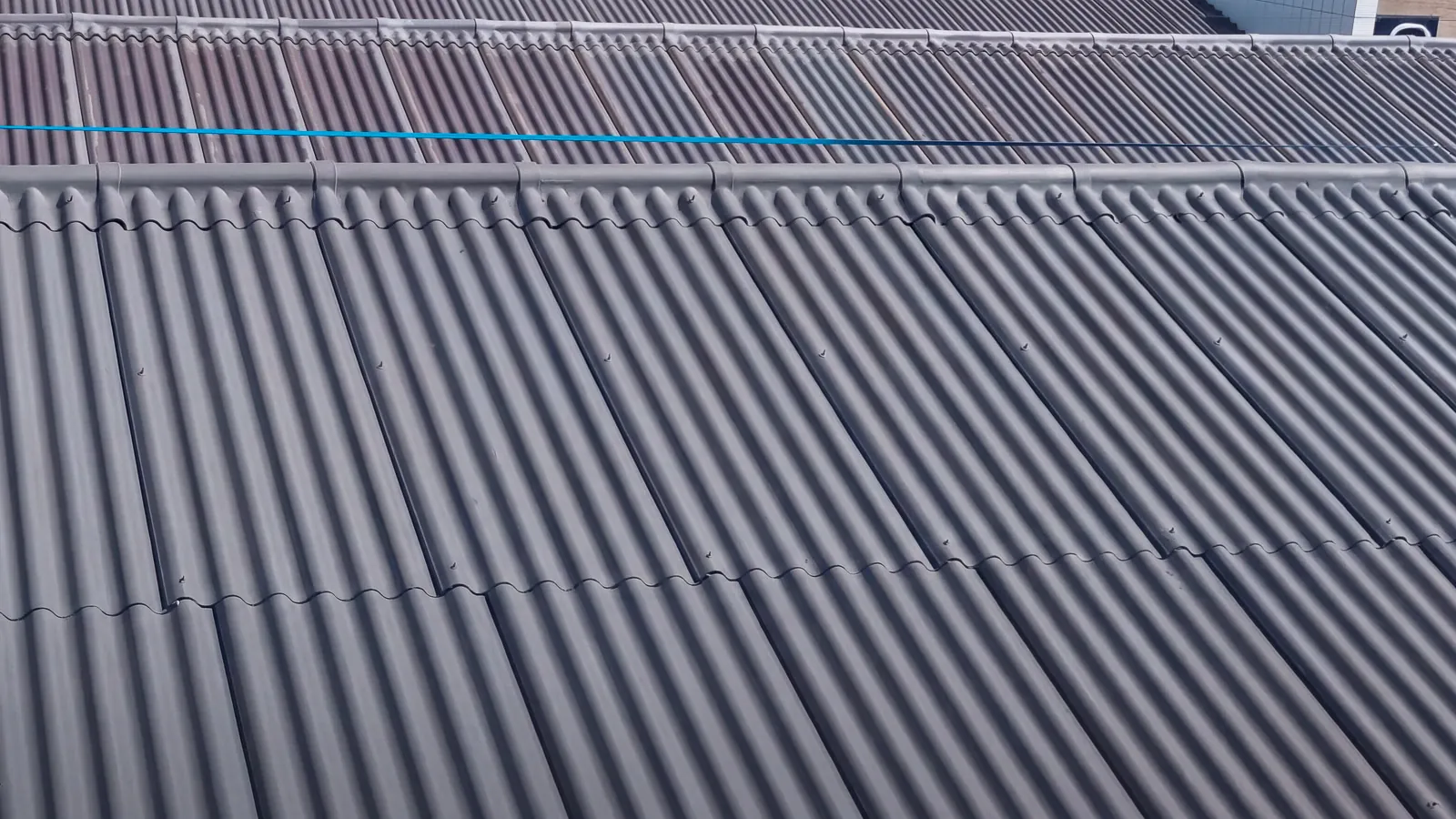 Coated profiled factory roof