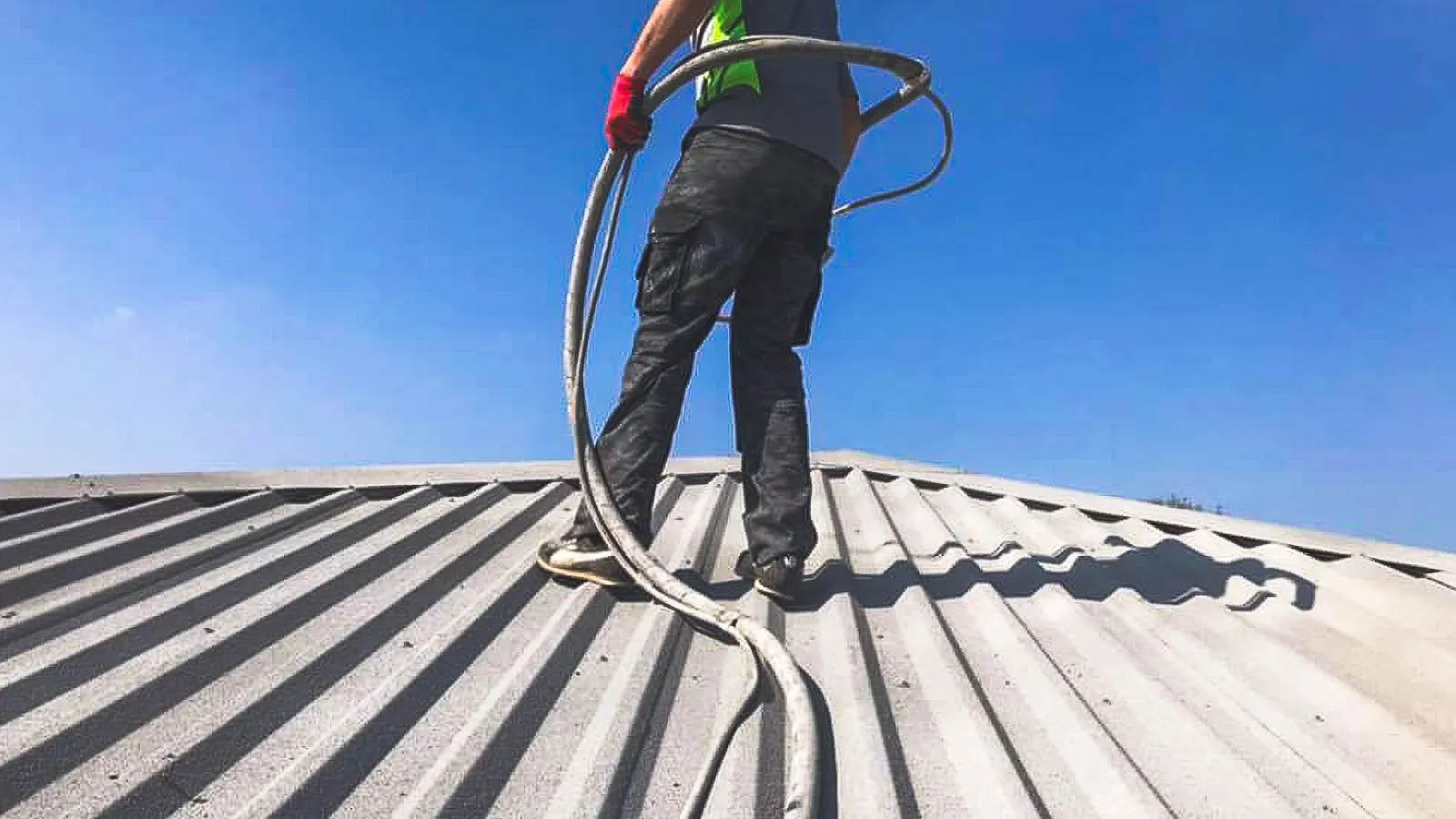 Roof coating application during refurbishment