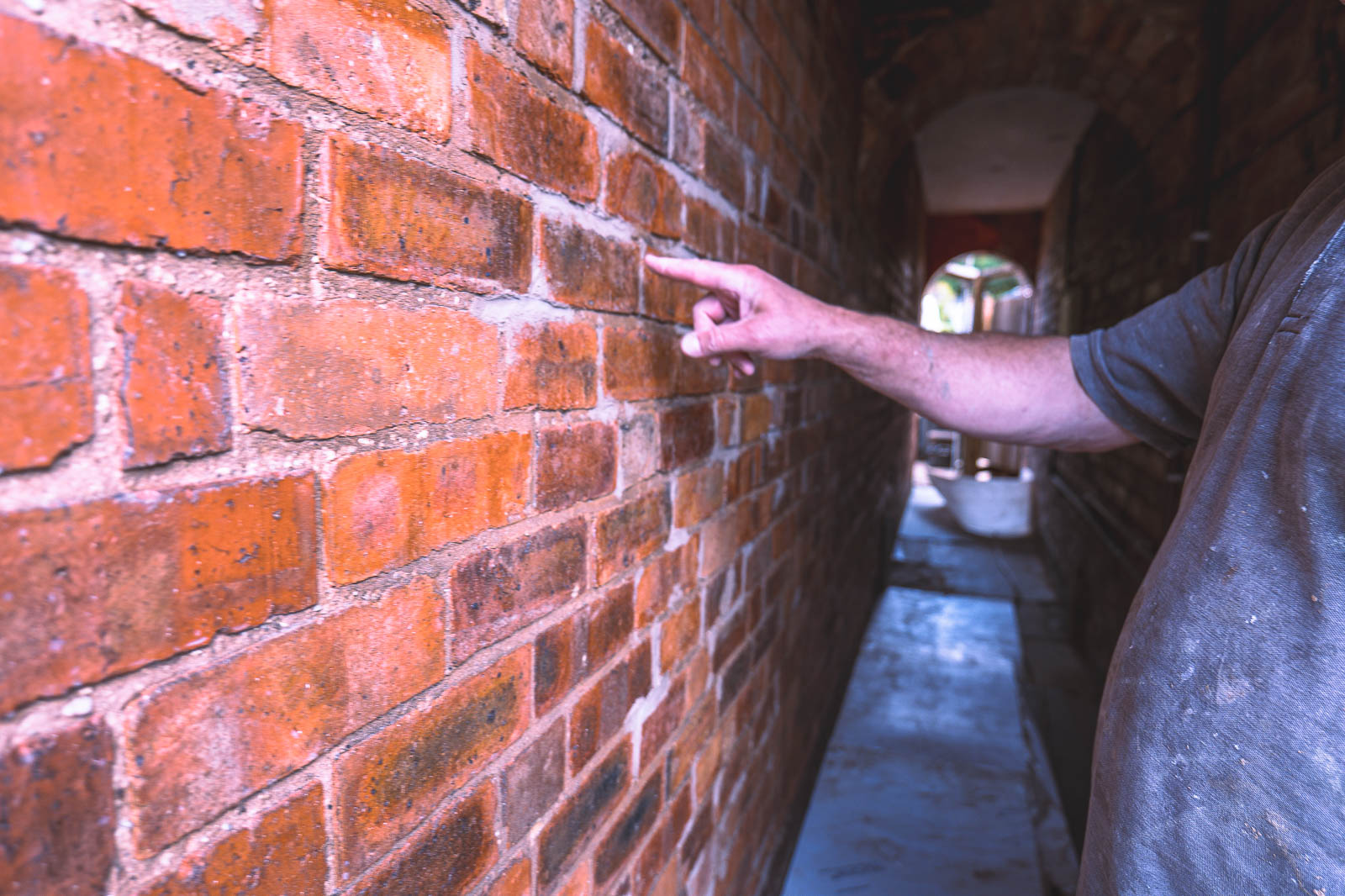 Existing red brick in the narrow arched Kings Norton passage before coating