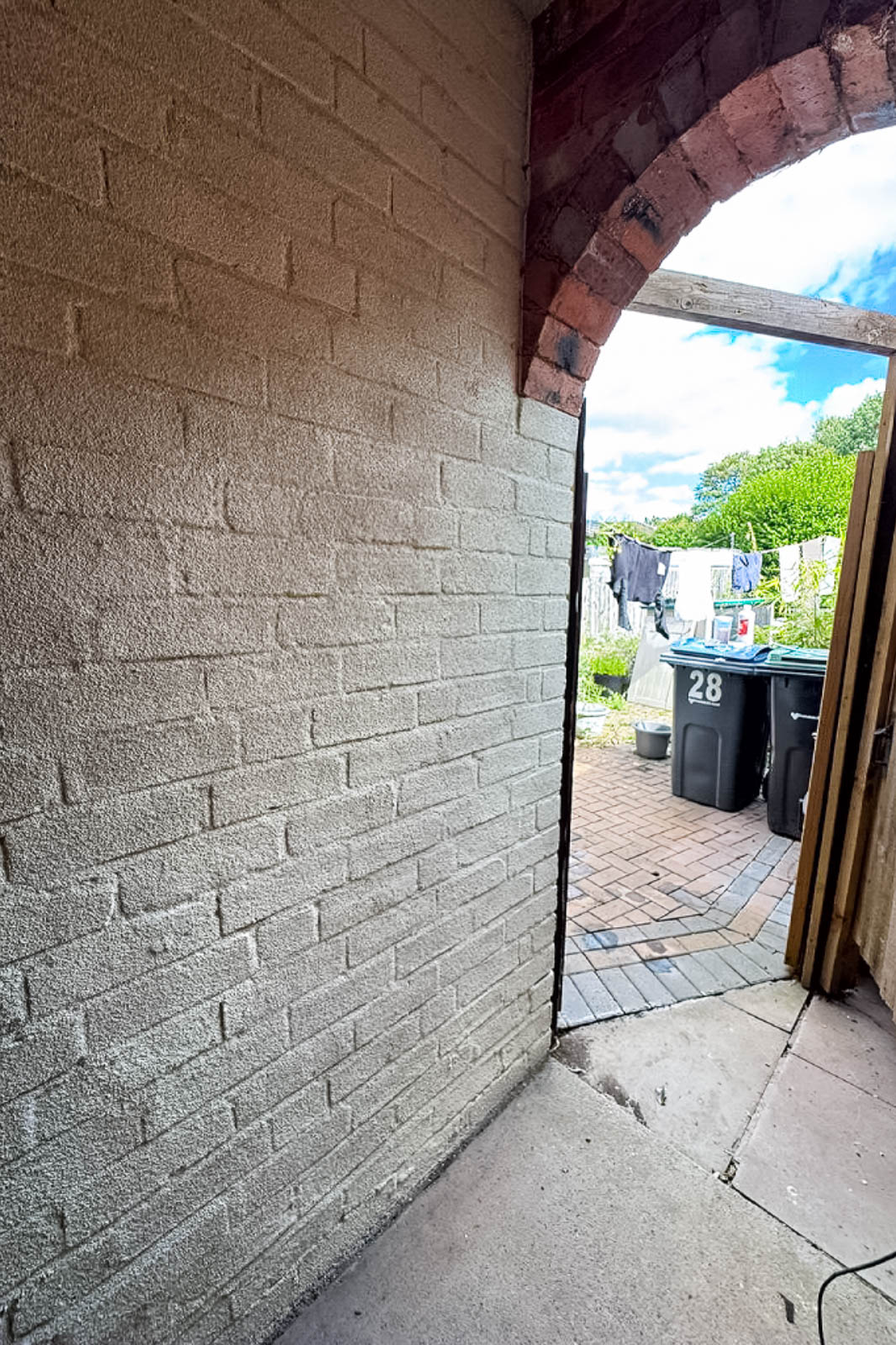 Light spray cork finish over brickwork in the Kings Norton arched rear passage