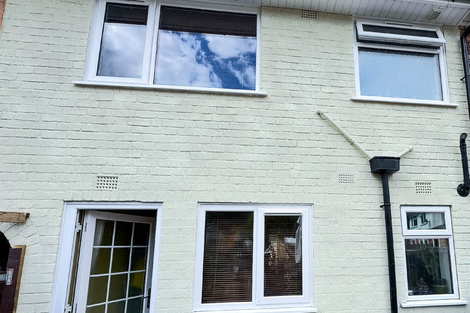 Completed Kings Norton rear elevation with light cork finish around windows and doors